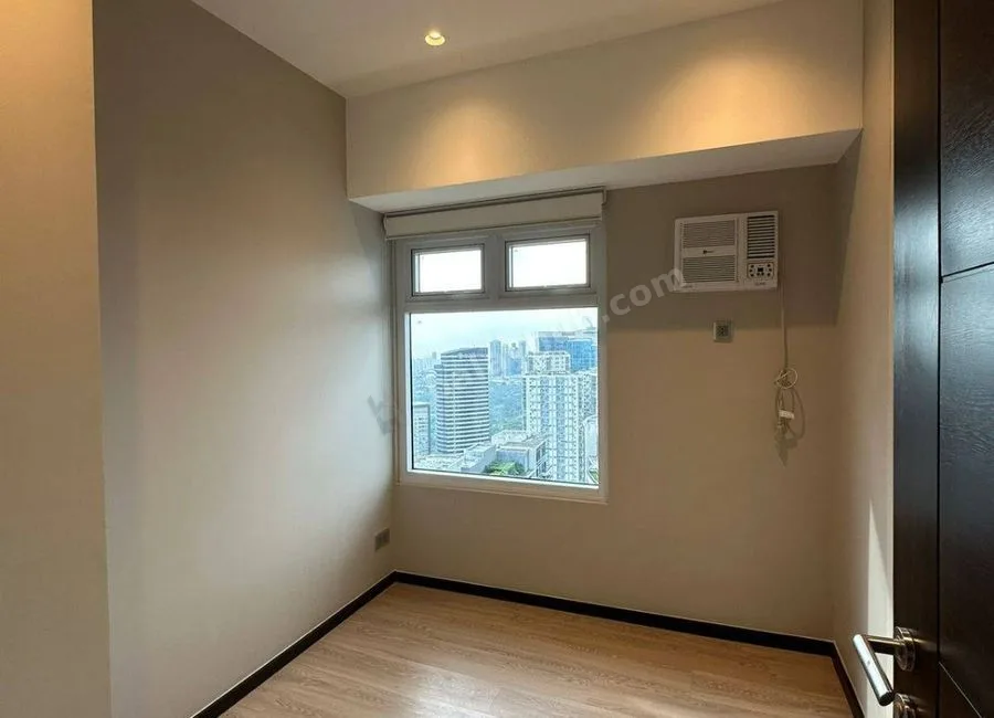FOR LEASE: 102 SQM Flat in The Trion Towers, Taguig City